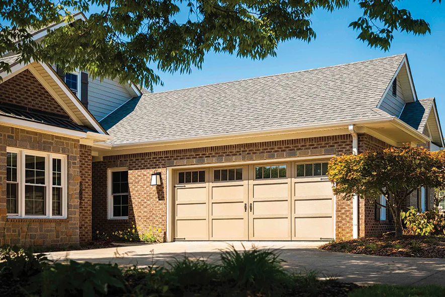 Brick ranch home with carriage-style garage doors in the Little Rock area